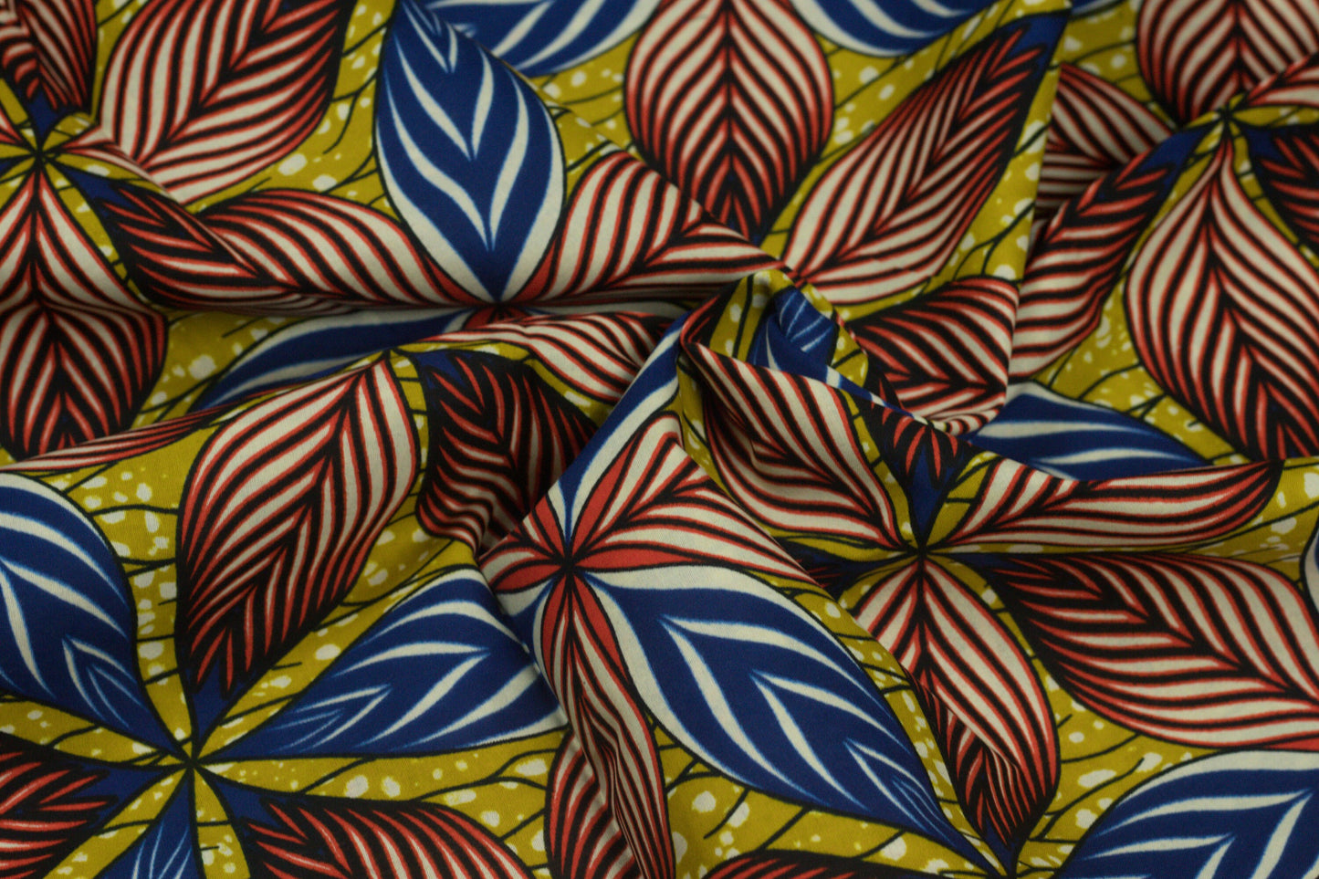 Multi coloured large leaves african ankara wax printed (100% cotton) fabric sold by the yard