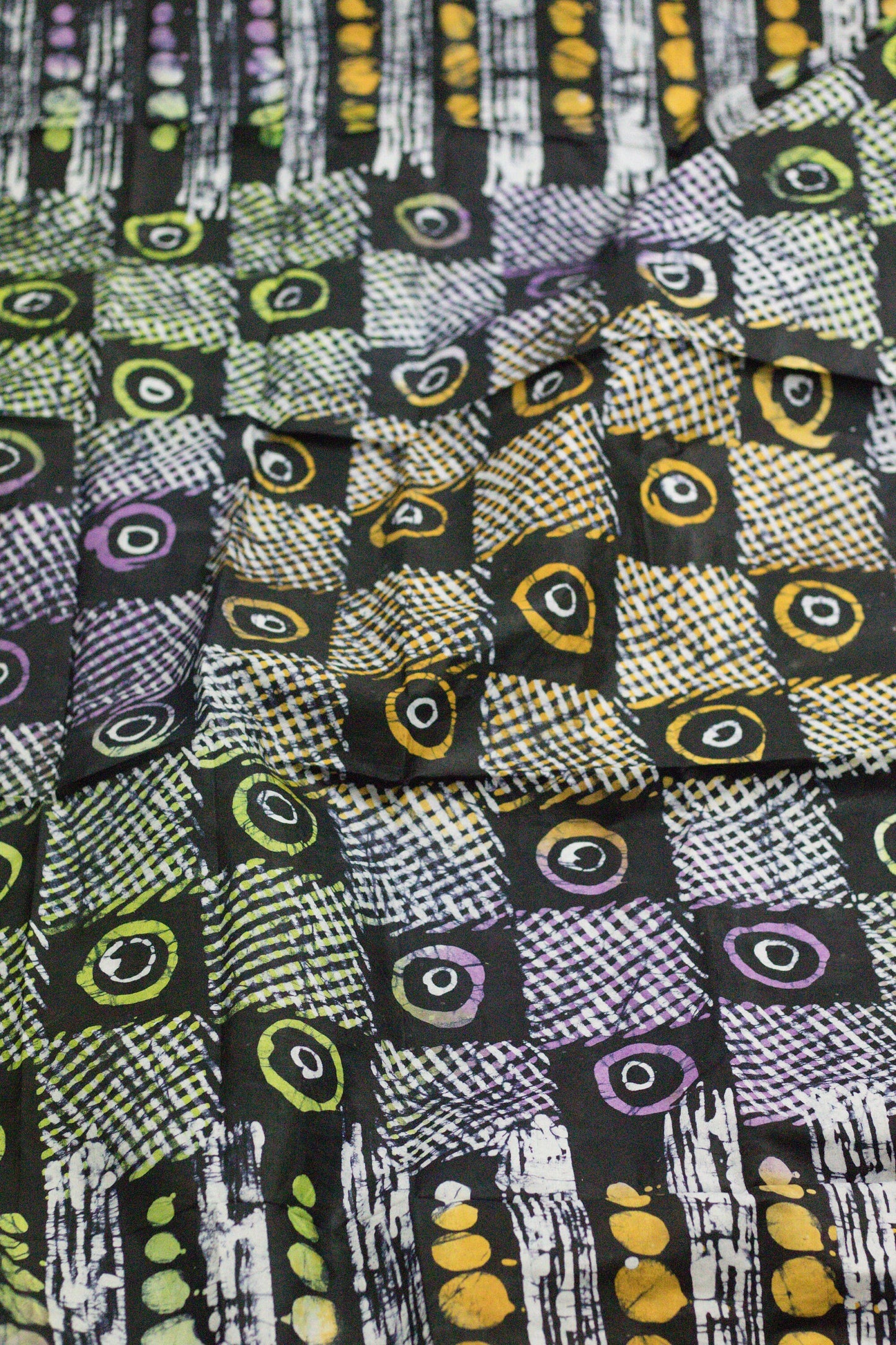 multicoloured dots and circles  hand printed African adire batik fabric sold by the yard